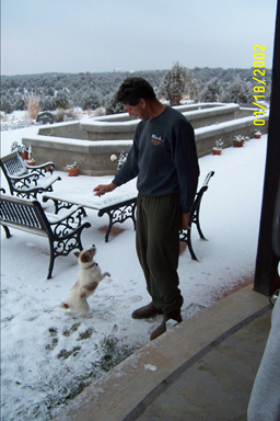 Darren Hanson playing 'fetch the snowball' on the Hanson's patio